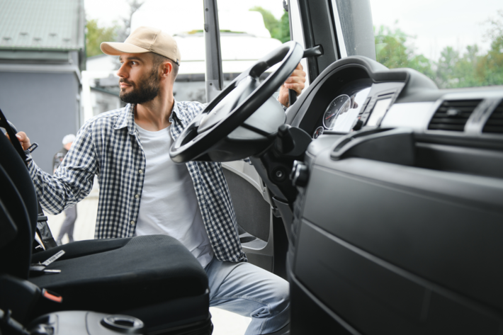 a man stand on vehicle